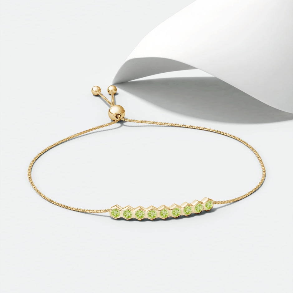 3mm AAA Natori x Angara Hexagonal Peridot Bolo Bracelet in Yellow Gold lifestyle