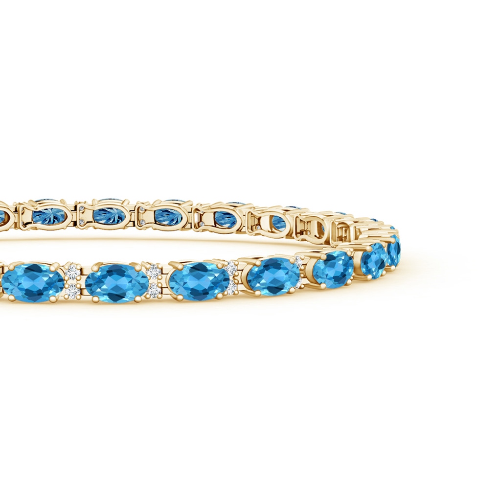 5x3mm AAA Classic Oval Swiss Blue Topaz and Diamond Tennis Bracelet in Yellow Gold Side-1