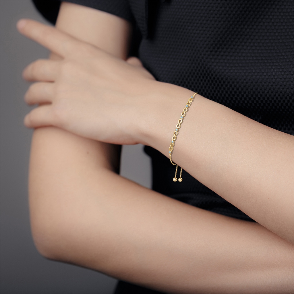 2.5mm AAA Bezel-Set Aquamarine Infinity Bolo Bracelet in Yellow Gold - body_bra