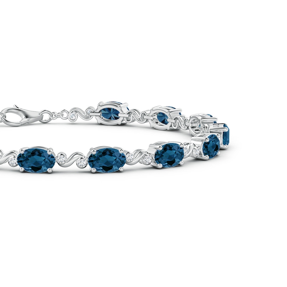 6x4mm AAA Oval London Blue Topaz Swirl Bracelet with Bezel Diamonds in White Gold side 1