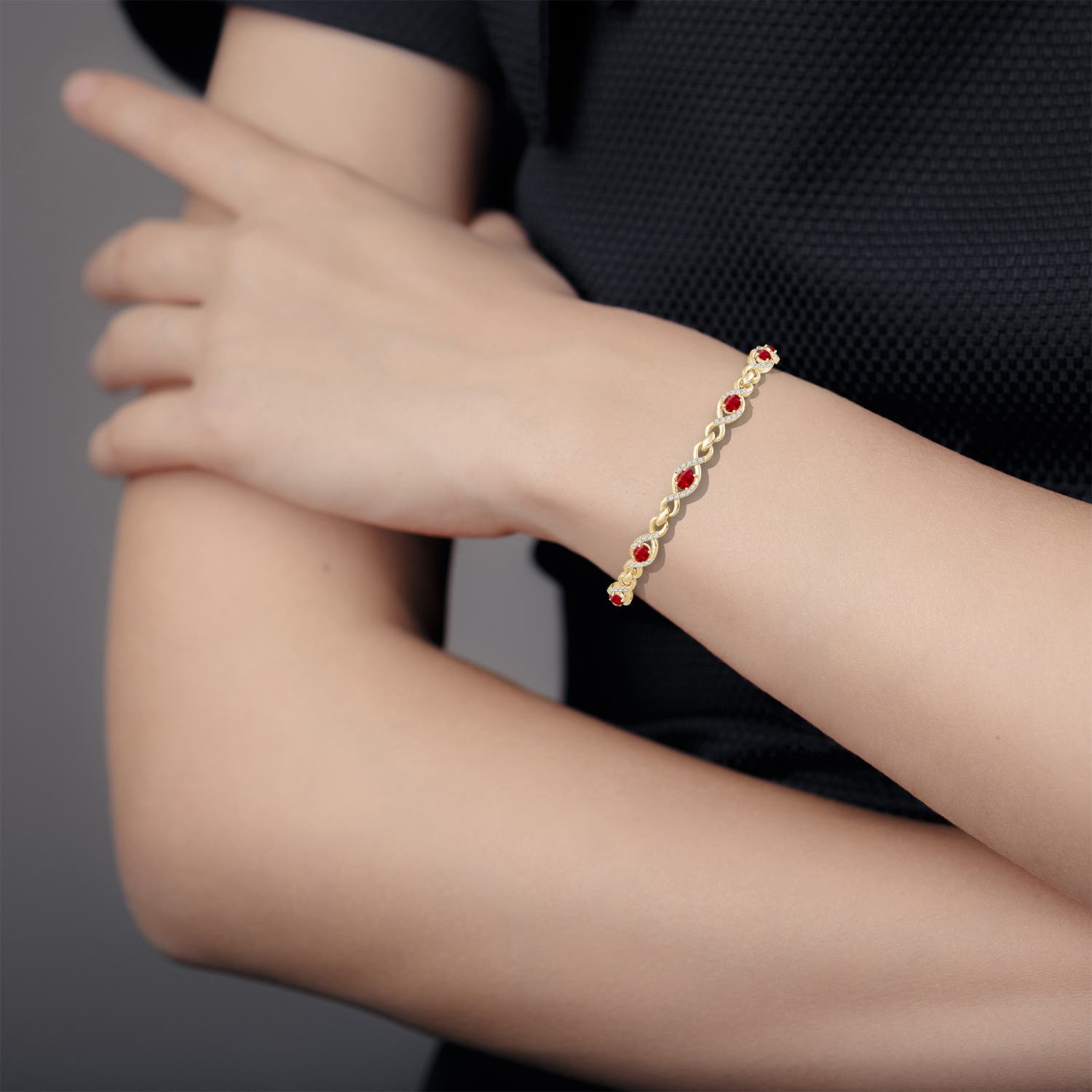 4x3mm AAA Oval Ruby Infinity Link Bracelet with Diamonds in Yellow Gold - body_view 2