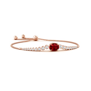 10x8mm AAAA Oval Ruby Bolo Bracelet with Bezel Diamonds in 10K Rose Gold