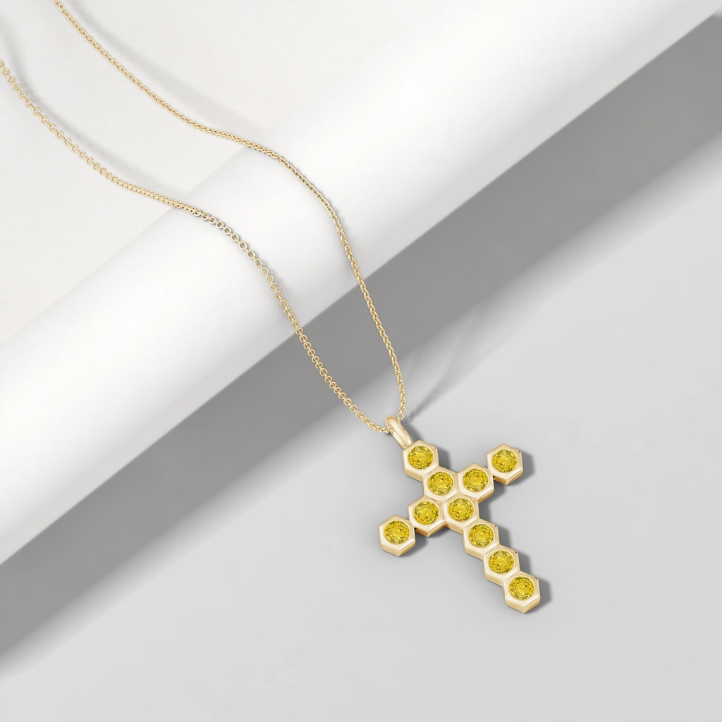 3mm AAA Natori x Angara Hexagonal Yellow Sapphire Cross Pendant in Yellow Gold Lifestyle
