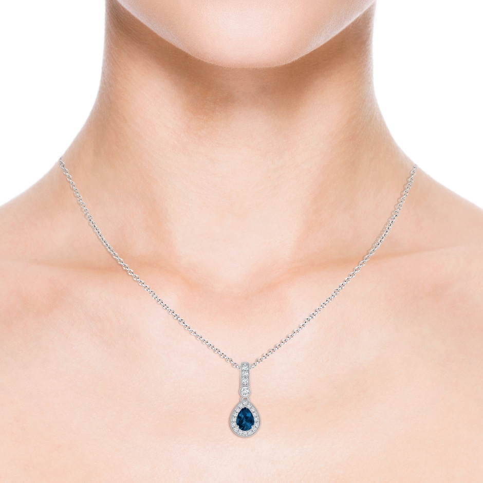 7x5mm AAA Pear-Shaped London Blue Topaz and pave Diamond Halo Pendant in White Gold body-neck