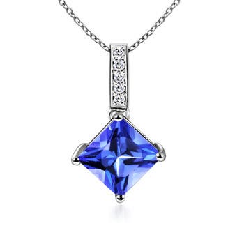 AAA - Tanzanite / 0.78 CT / 14 KT White Gold