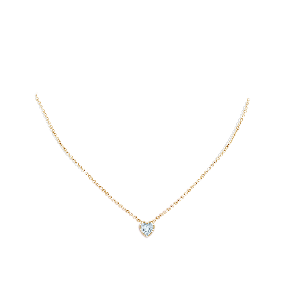 6mm A Bezel-Set Solitaire Heart Aquamarine Pendant in Yellow Gold body-neck