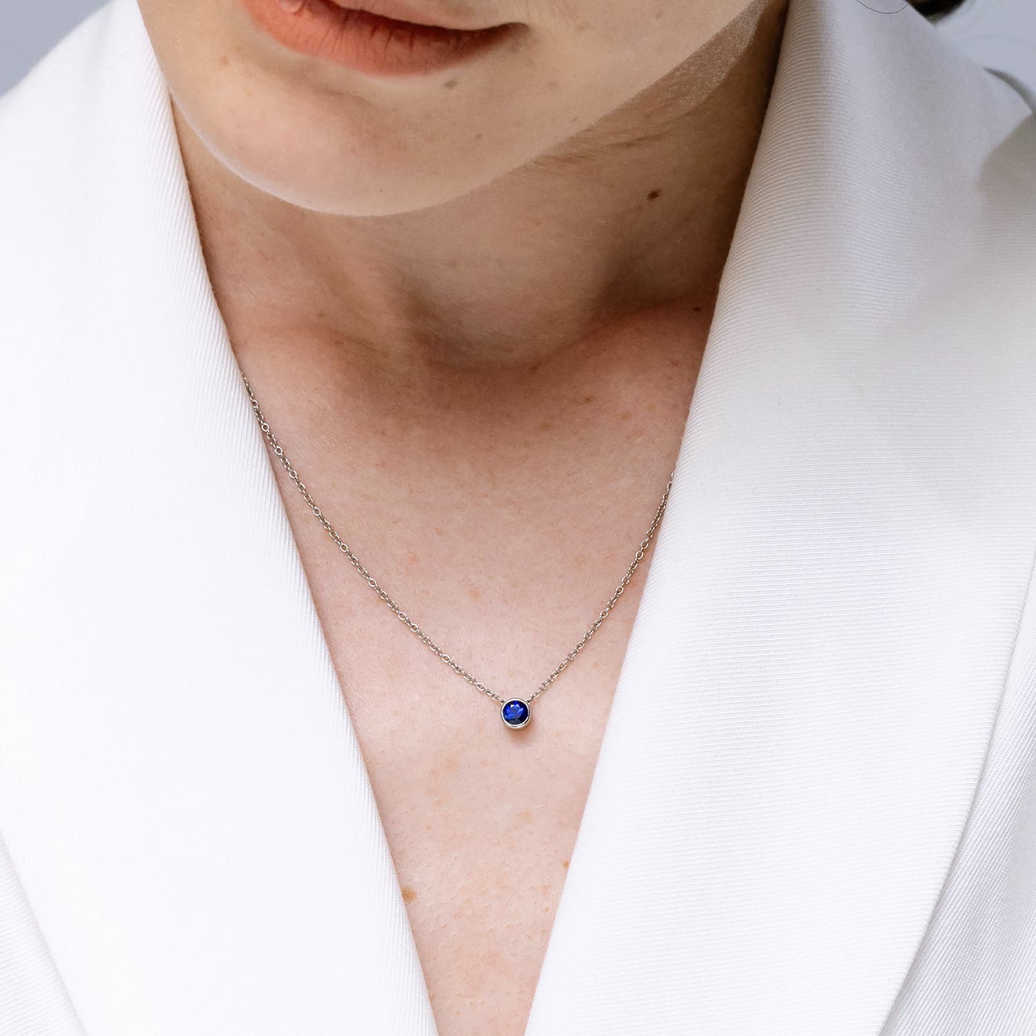 5mm AAA Bezel-Set Round Blue Sapphire Solitaire Pendant in Yellow Gold