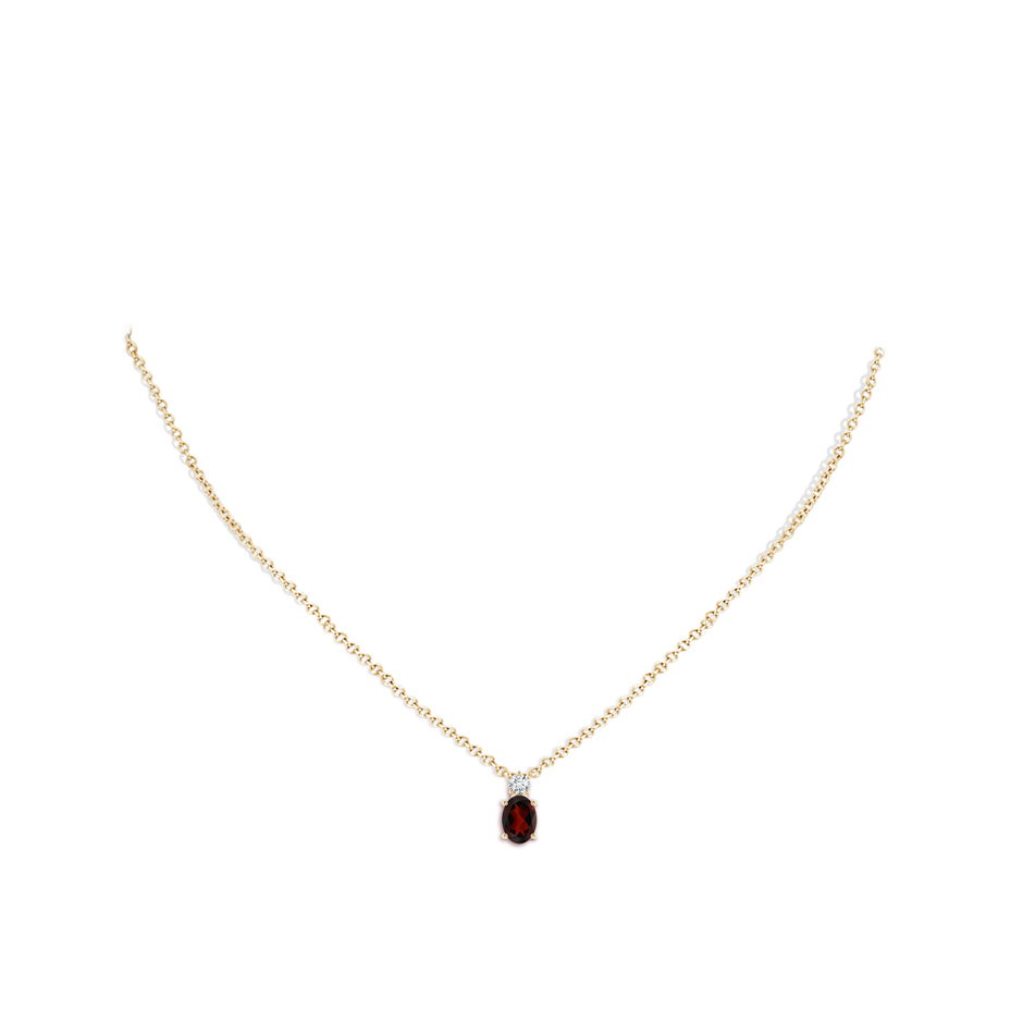 7x5mm AA Oval Garnet Solitaire Pendant with Diamond in Yellow Gold body-neck