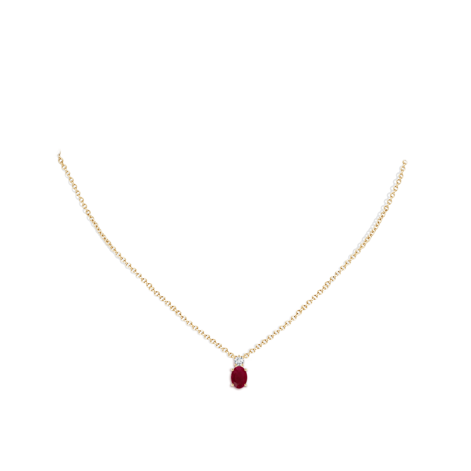 7x5mm A Oval Ruby Solitaire Pendant with Diamond in Yellow Gold pen