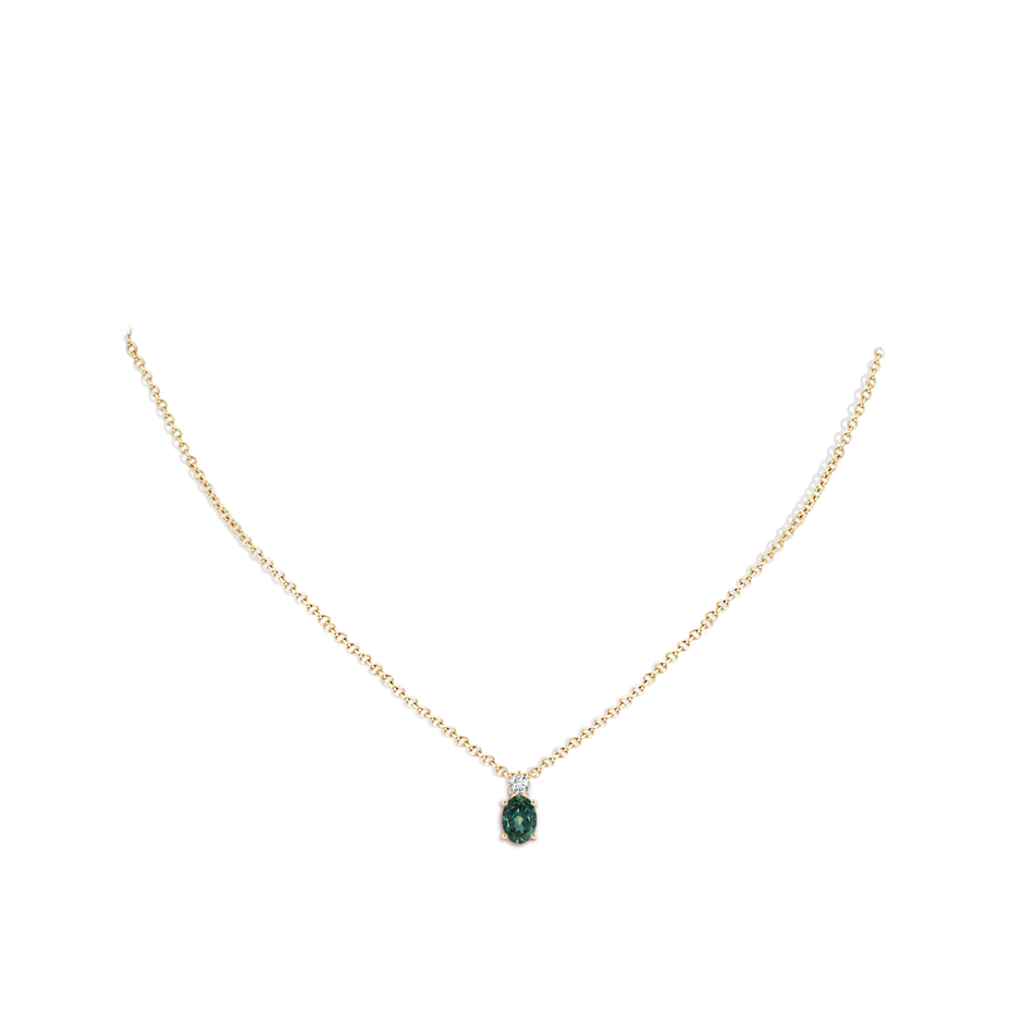 7x5mm AA Oval Teal Montana Sapphire Solitaire Pendant with Diamond in Yellow Gold body-neck
