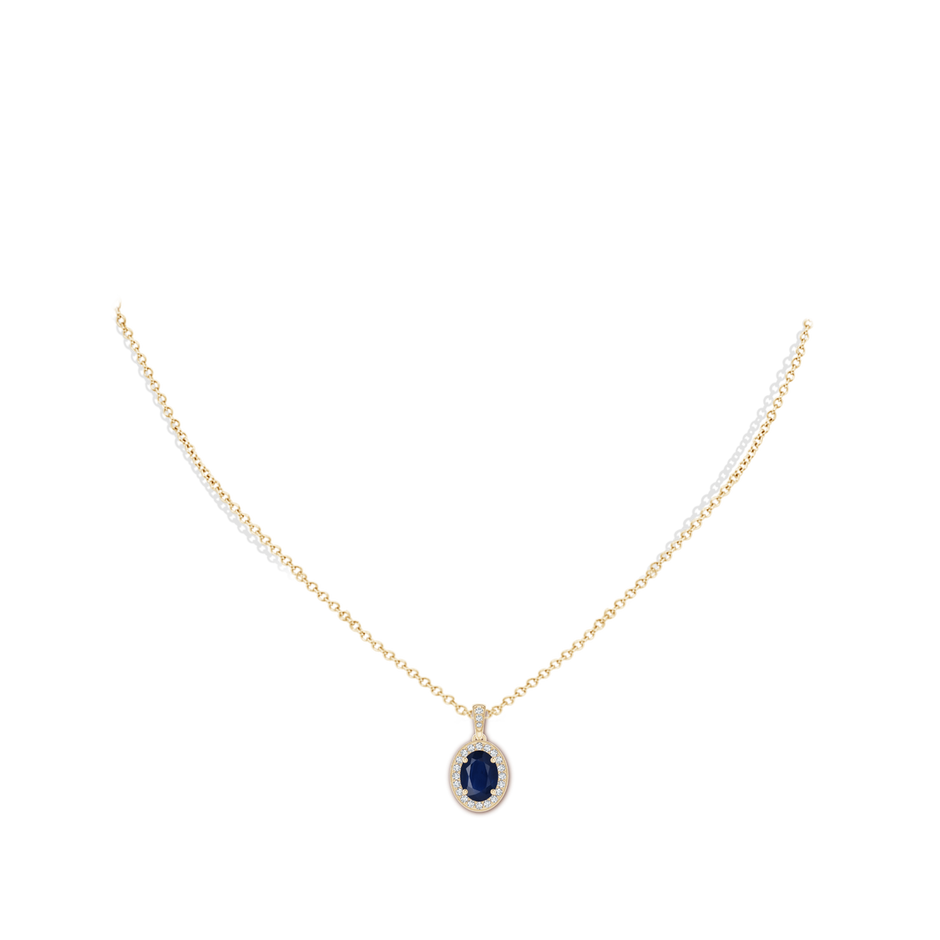 8x6mm A Vintage Style Oval Sapphire Pendant with Diamond Halo in Yellow Gold pen