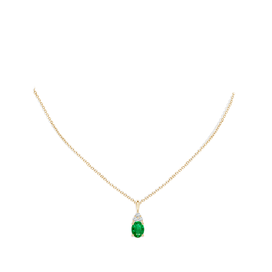 9x7mm AAA Oval Emerald Solitaire Pendant with Trio Diamond in Yellow Gold pen