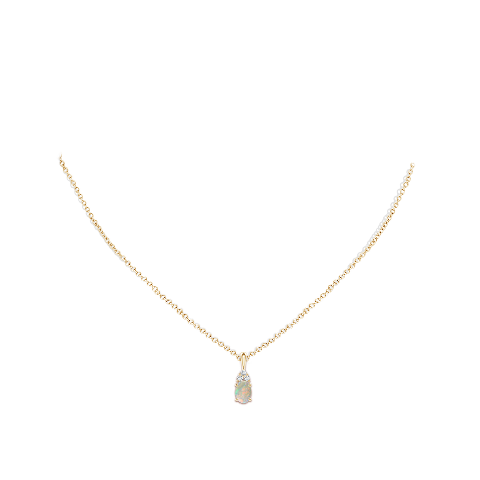 7x5mm AAAA Oval Opal Solitaire Pendant with Trio Diamond in Yellow Gold body-neck