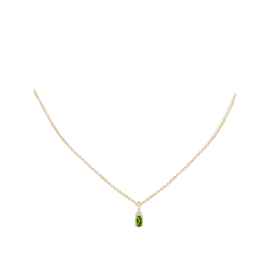 6x4mm AAAA Oval Peridot Solitaire Pendant with Trio Diamond in Yellow Gold body-neck