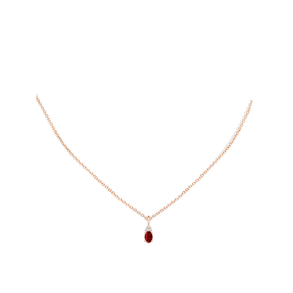 6x4mm AAAA Oval Ruby Solitaire Pendant with Trio Diamond in Rose Gold pen