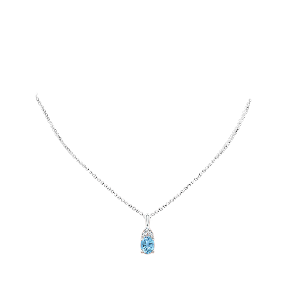 9x7mm A Oval Swiss Blue Topaz Solitaire Pendant with Trio Diamond in White Gold body-neck