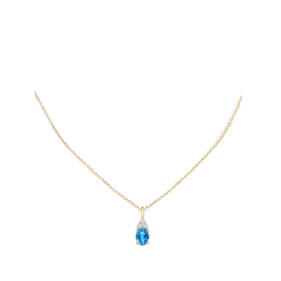 9x7mm AAAA Oval Swiss Blue Topaz Solitaire Pendant with Trio Diamond in Yellow Gold body-neck