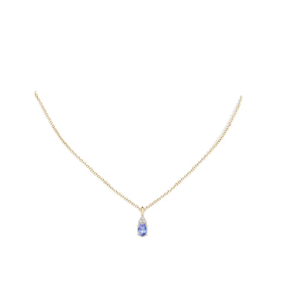 7x5mm A Oval Tanzanite Solitaire Pendant with Trio Diamond in Yellow Gold body-neck