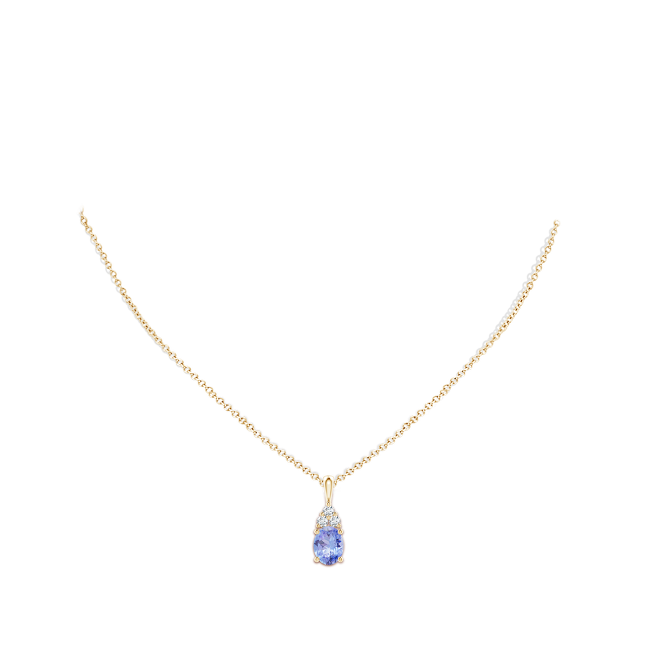 9x7mm A Oval Tanzanite Solitaire Pendant with Trio Diamond in Yellow Gold body-neck