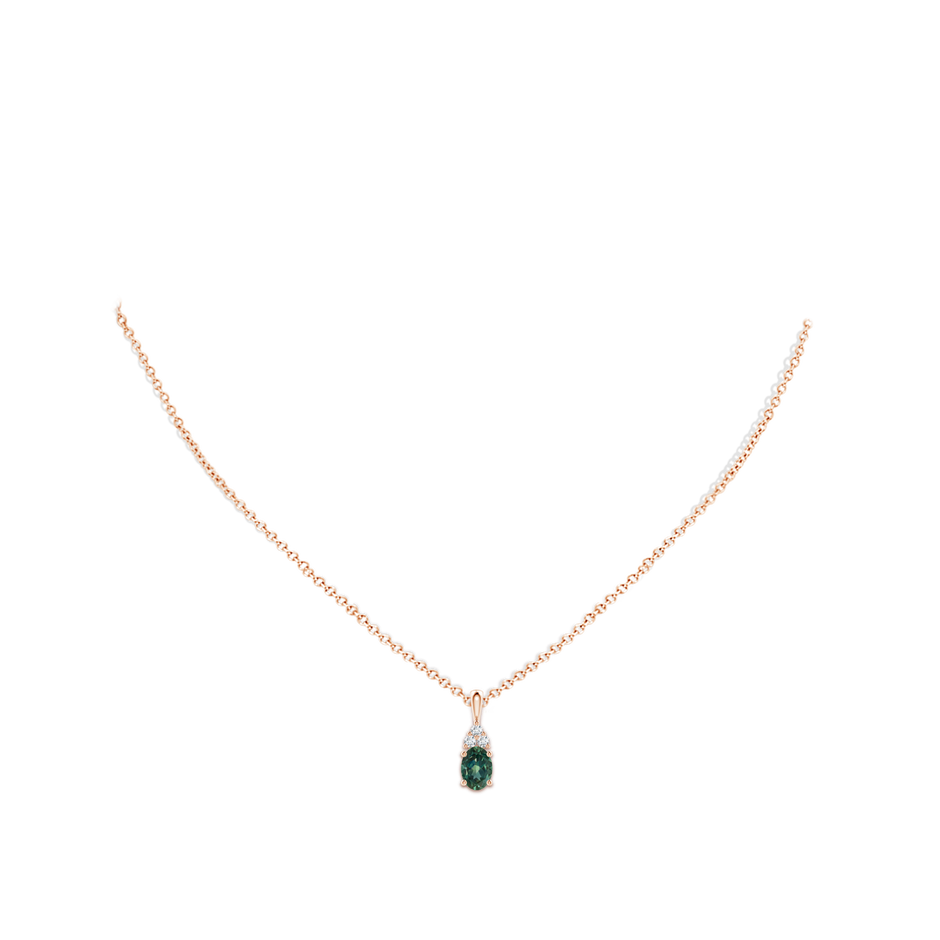 7x5mm AA Oval Teal Montana Sapphire Solitaire Pendant with Trio Diamond in Rose Gold body-neck