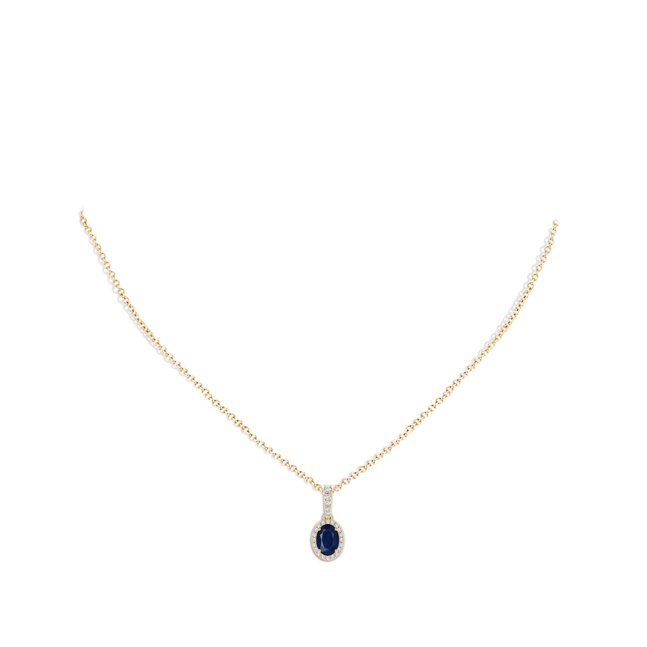 7x5mm A Vintage Style Oval Sapphire Halo Pendant in Yellow Gold pen