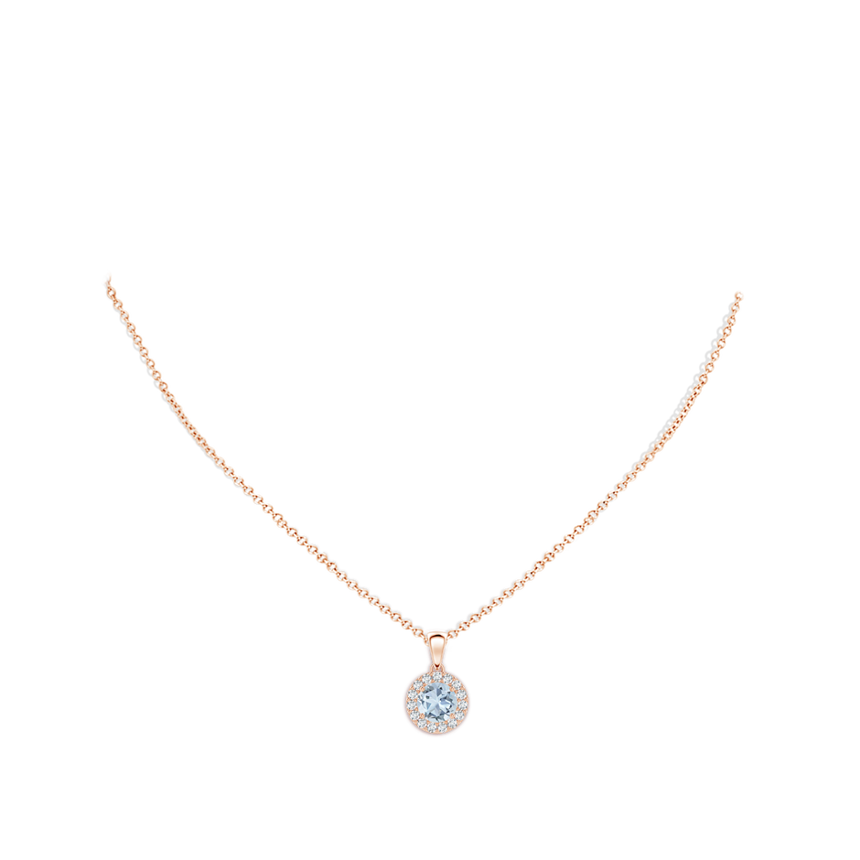 6mm A Round Aquamarine and Diamond Halo Pendant in Rose Gold body-neck