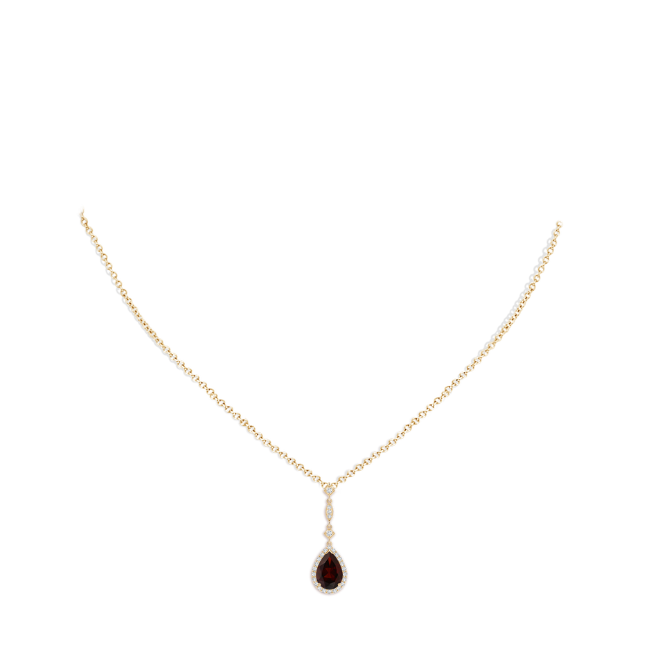 9x6mm A Prong-Set Garnet Teardrop Halo Pendant with Diamond Accents in 18K Yellow Gold pen