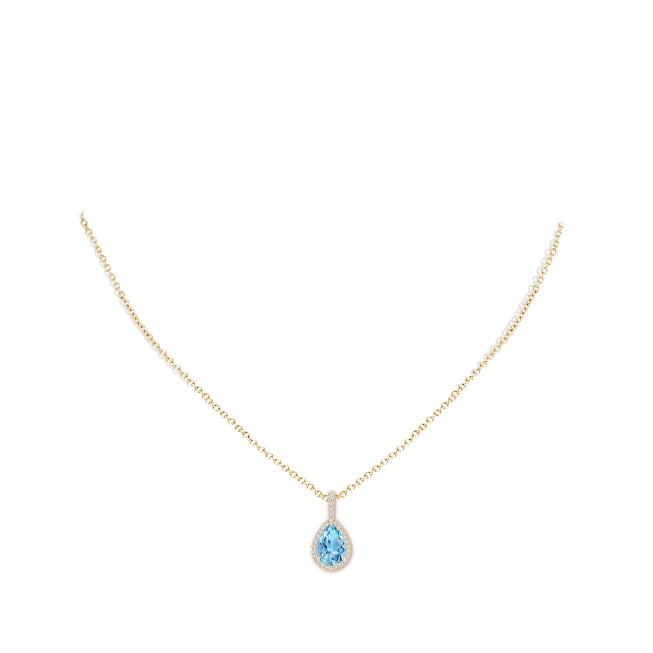 10x7mm A Claw-Set Swiss Blue Topaz Teardrop Halo Pendant in Yellow Gold pen