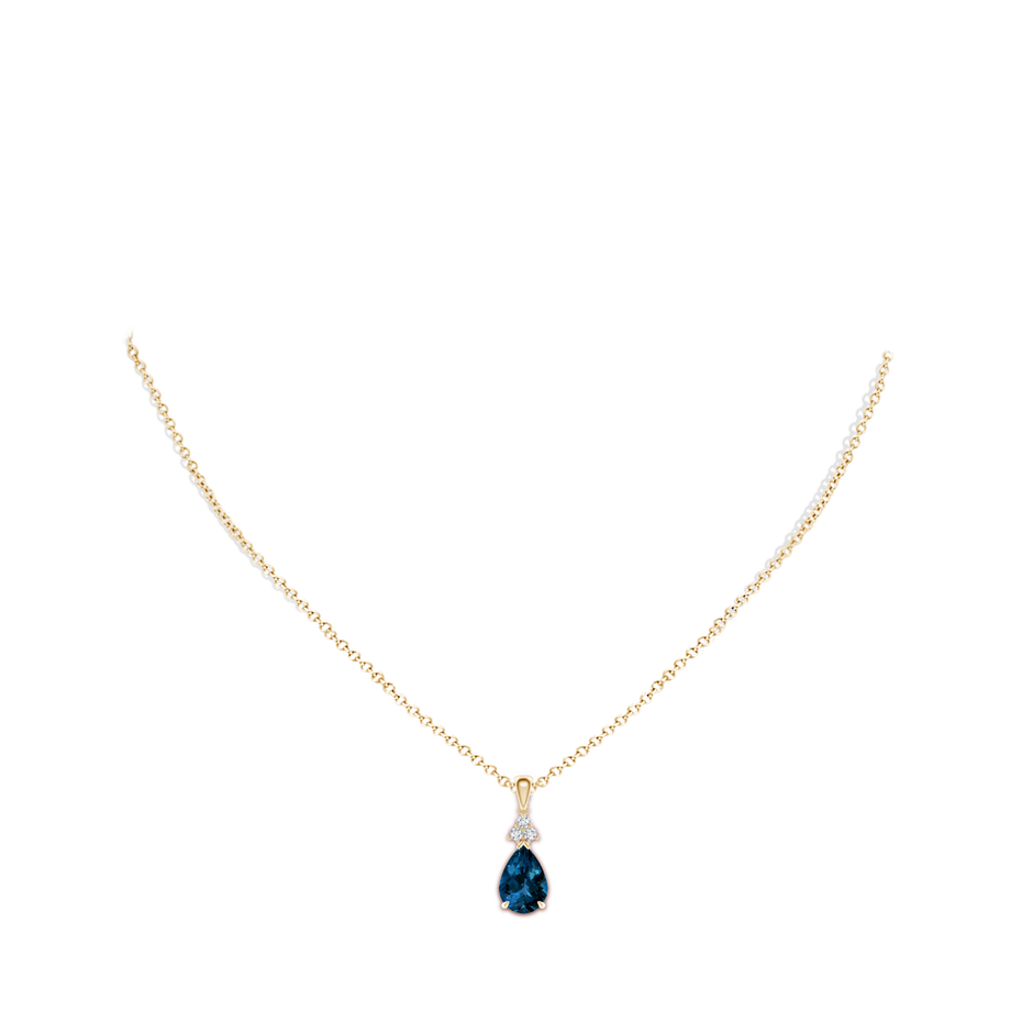 10x7mm AAAA Claw-Set London Blue Topaz Drop Pendant with Trio Diamonds in Yellow Gold pen