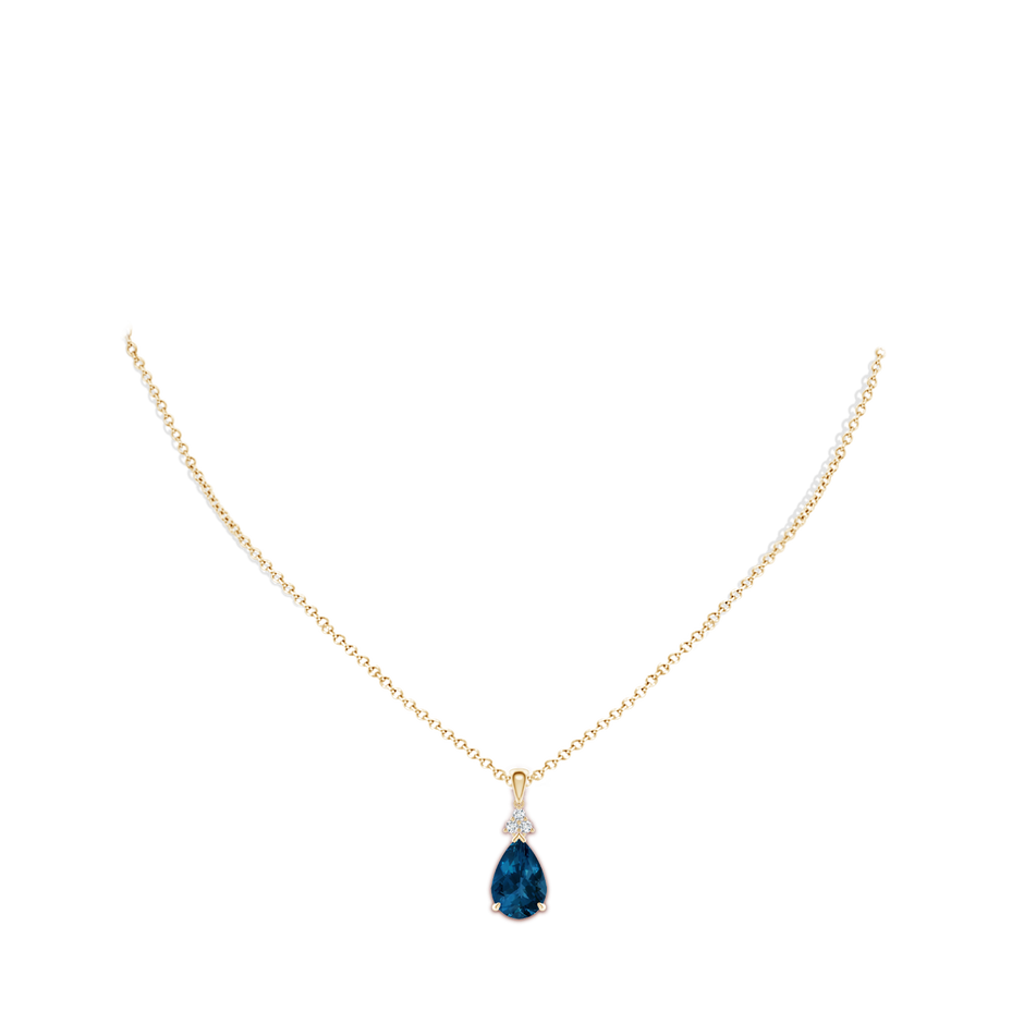 12x8mm AAA Claw-Set London Blue Topaz Drop Pendant with Trio Diamonds in Yellow Gold body-neck