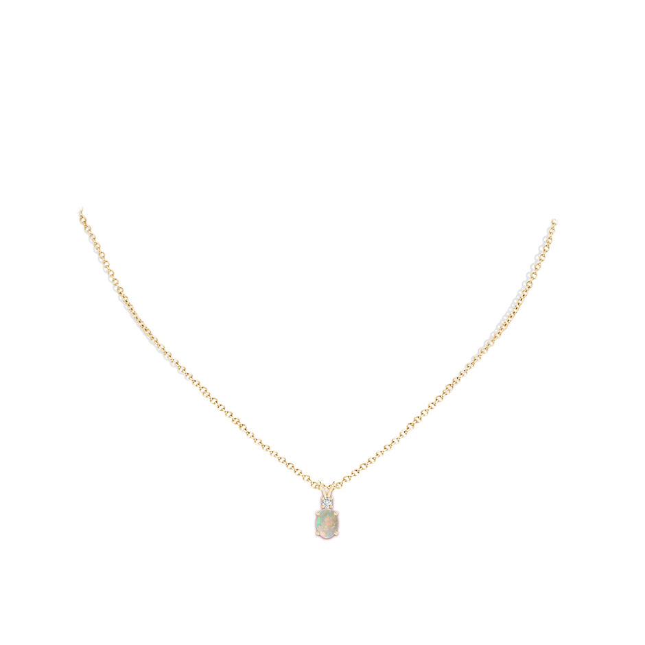 7x5mm AAAA Oval Opal V-Bale Pendant with Diamond Accent in Yellow Gold body-neck