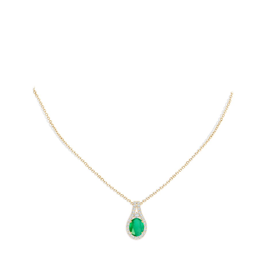 10x8mm A Classic Emerald and Diamond Halo Pendant in 18K Yellow Gold pen