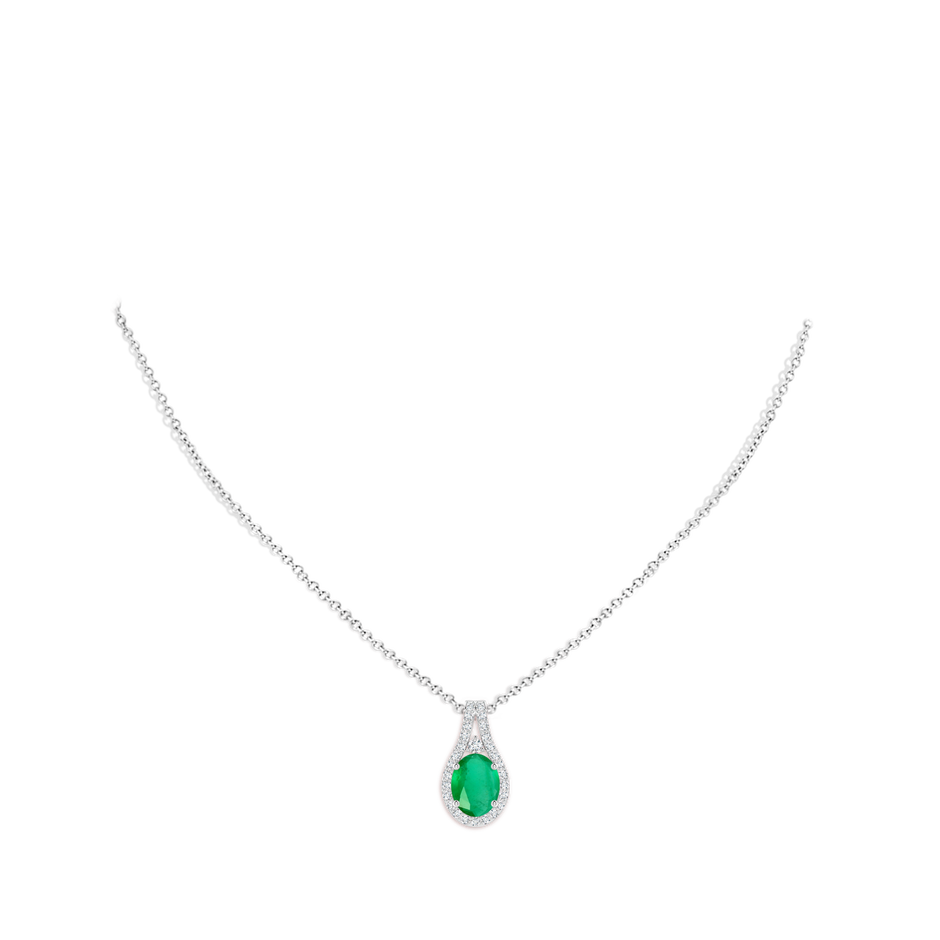 9x7mm A Classic Emerald and Diamond Halo Pendant in White Gold pen