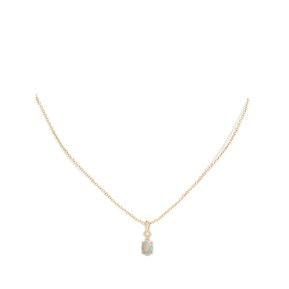 7x5mm AAAA Oval Opal Dangle Pendant with Infinity Loop Bale in Yellow Gold pen