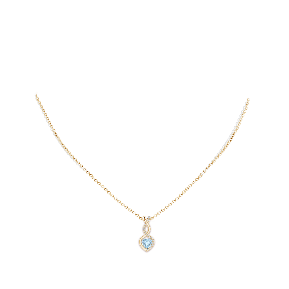 6mm AA Heart-Shaped Aquamarine Infinity Pendant with Diamond Accents in Yellow Gold pen