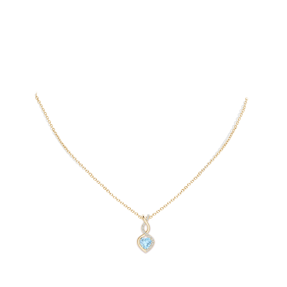 7mm AAA Heart-Shaped Aquamarine Infinity Pendant with Diamond Accents in Yellow Gold pen