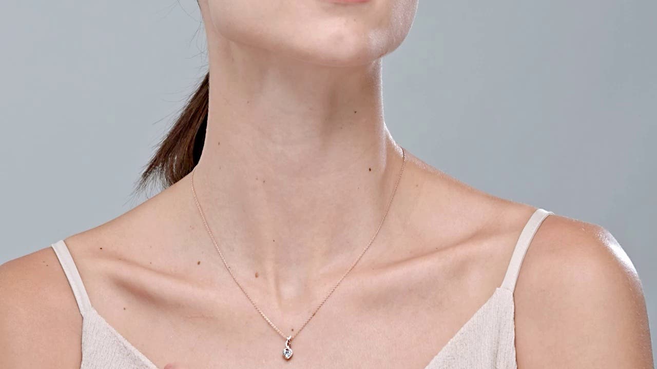 Heart-Shaped Aquamarine Infinity Pendant with Diamond Accents