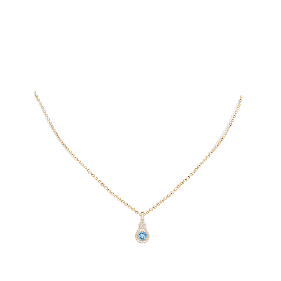 5mm AAAA Aquamarine Knotted Heart Pendant with Diamond in Yellow Gold body-neck