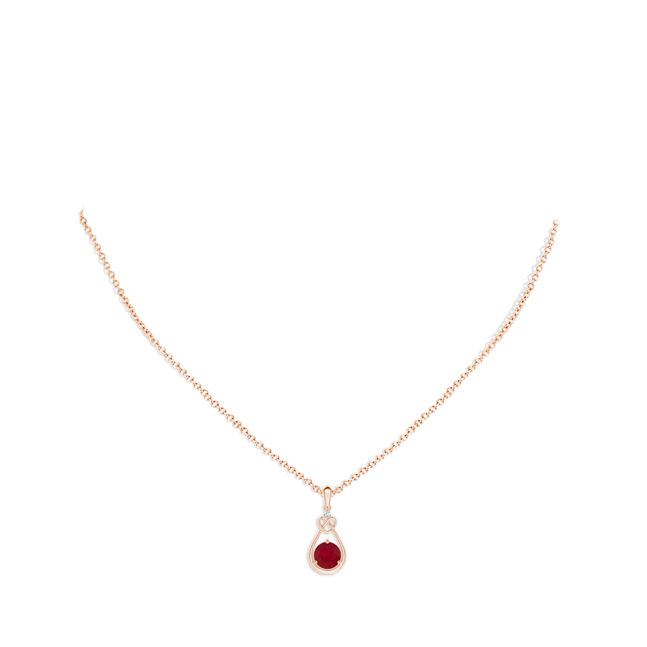 6mm AA Ruby Knotted Heart Pendant with Diamond in Rose Gold pen
