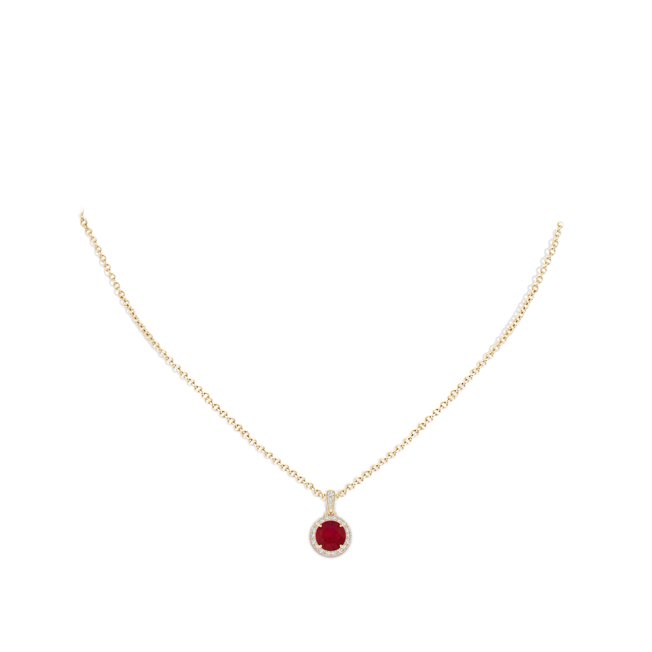 7mm AA Claw-Set Round Ruby Pendant with Diamond Halo in Yellow Gold pen