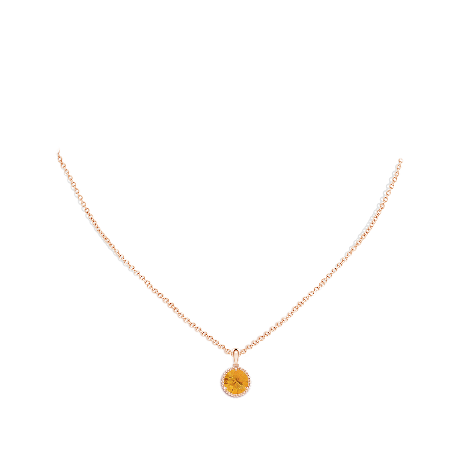 8mm A Rope-Framed Claw-Set Fire Opal Solitaire Pendant in Rose Gold pen