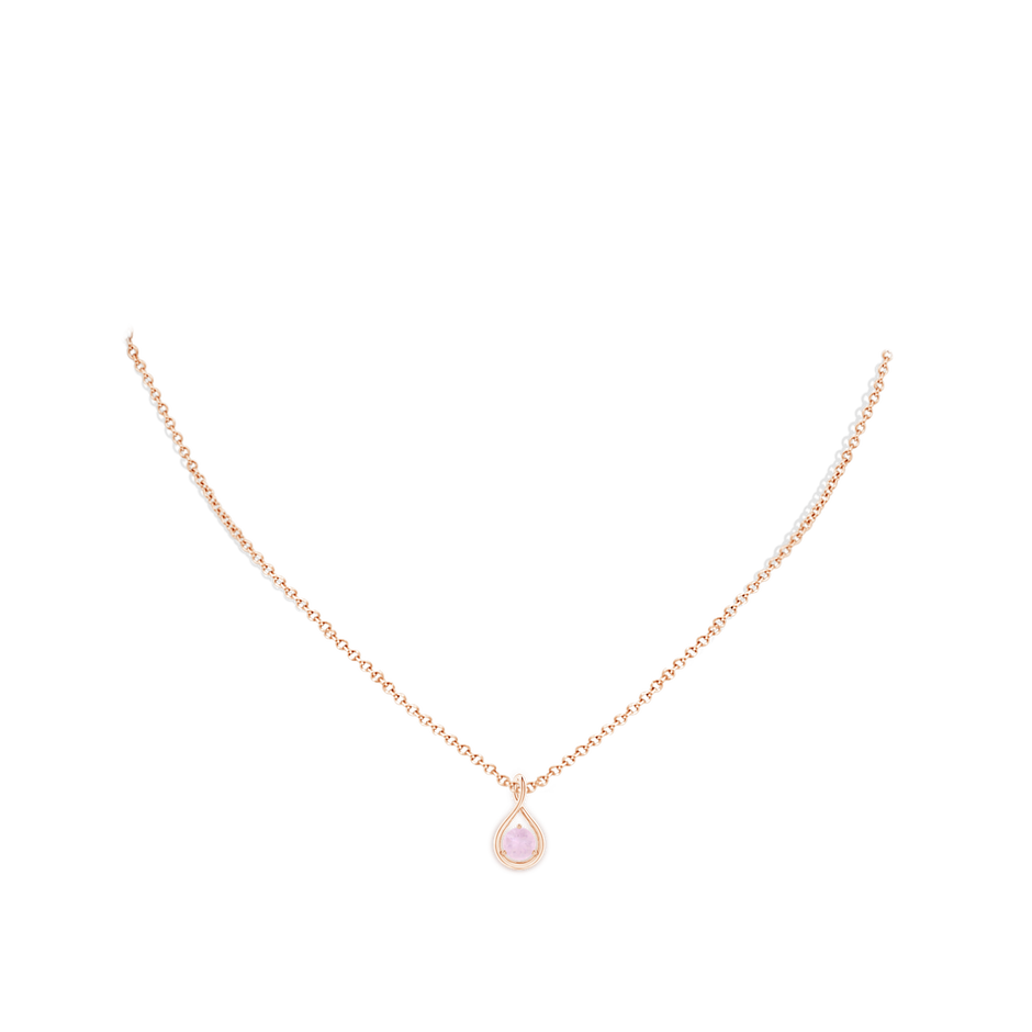 5mm AA Solitaire Round Rose Quartz Infinity Twist Pendant in Rose Gold body-neck
