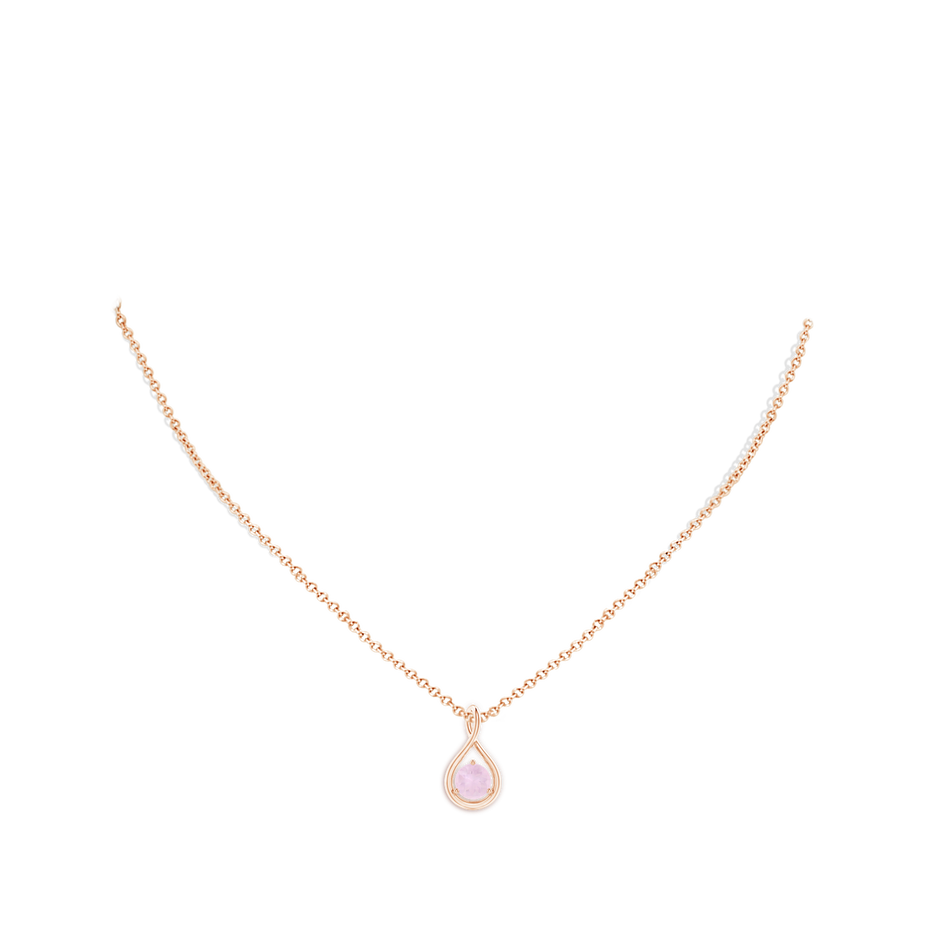 6mm AA Solitaire Round Rose Quartz Infinity Twist Pendant in Rose Gold body-neck
