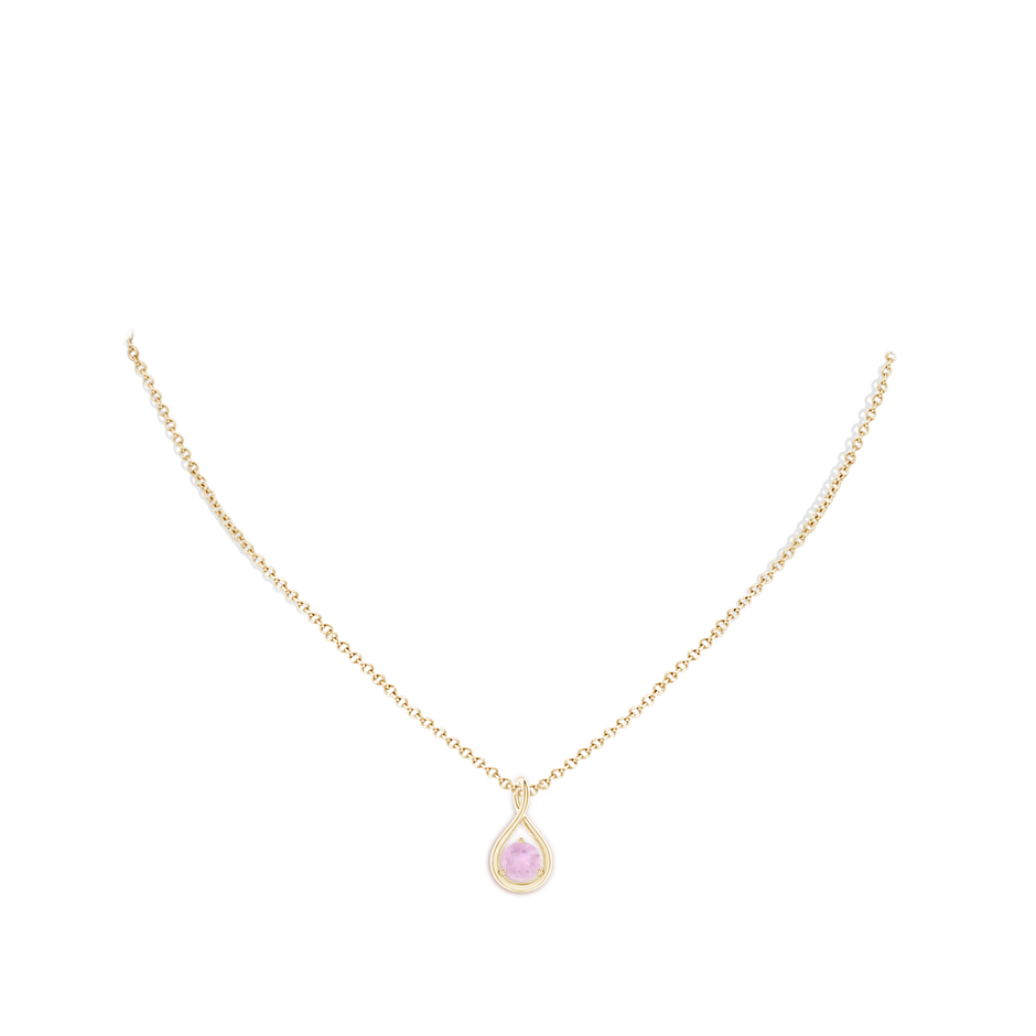 6mm AAAA Solitaire Round Rose Quartz Infinity Twist Pendant in Yellow Gold body-neck