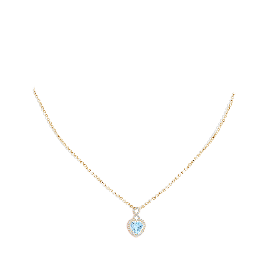7mm AAA Aquamarine Infinity Heart Pendant with Diamond Halo in Yellow Gold pen