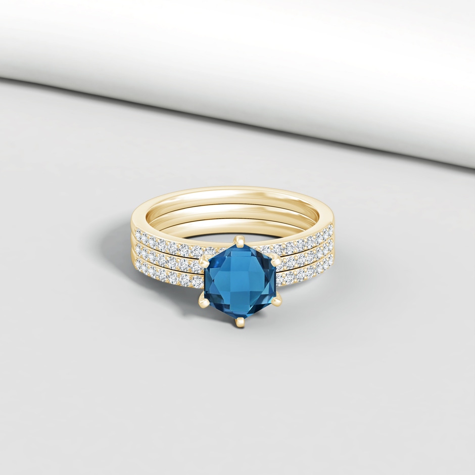 7mm AAA Natori x Angara Hexagonal London Blue Topaz Triple Shank Ring in Yellow Gold lifestyle