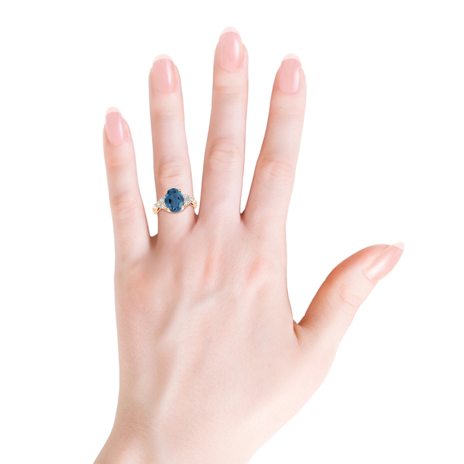 10x8mm A Oval London Blue Topaz Cocktail Ring with Trio Diamonds in Rose Gold product image