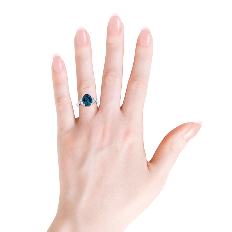 10x8mm AAA Oval London Blue Topaz Cocktail Ring with Trio Diamonds in White Gold product image