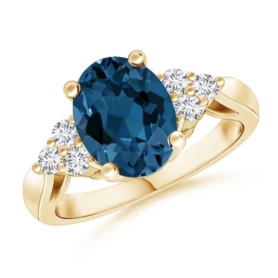 9x7mm AAA Oval London Blue Topaz Cocktail Ring with Trio Diamonds in Yellow Gold 