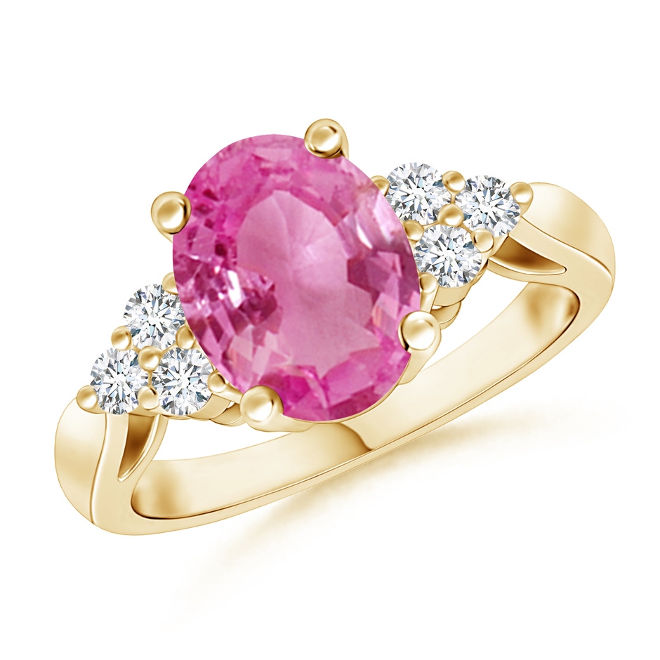 9x7mm AAA Oval Pink Sapphire Cocktail Ring With Trio Diamond Accents in Yellow Gold 